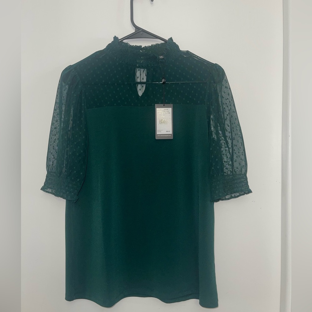 Hunter Green. See-through on top and sleeves. smooth & comfortable fit.